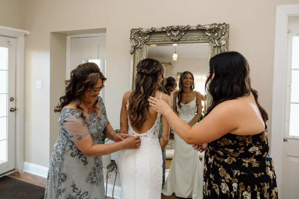 Bride laughs while getting ready for wedding in Pennsylvania