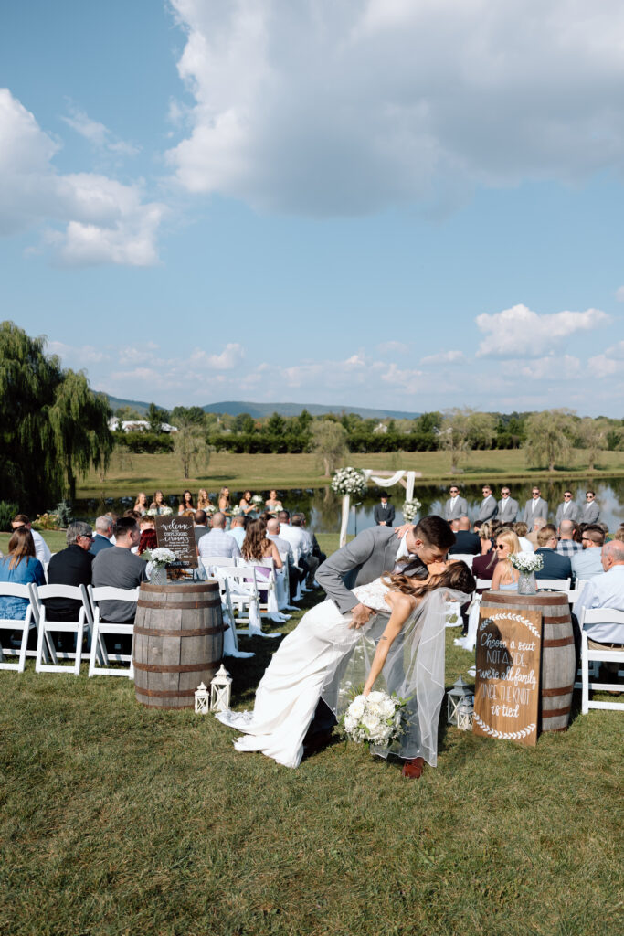 Bride and groom kiss outdoors