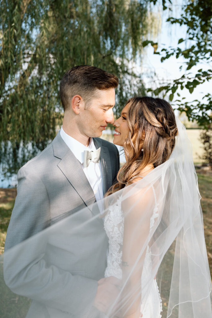 Couple smile outdoors in Pennsylvania wedding