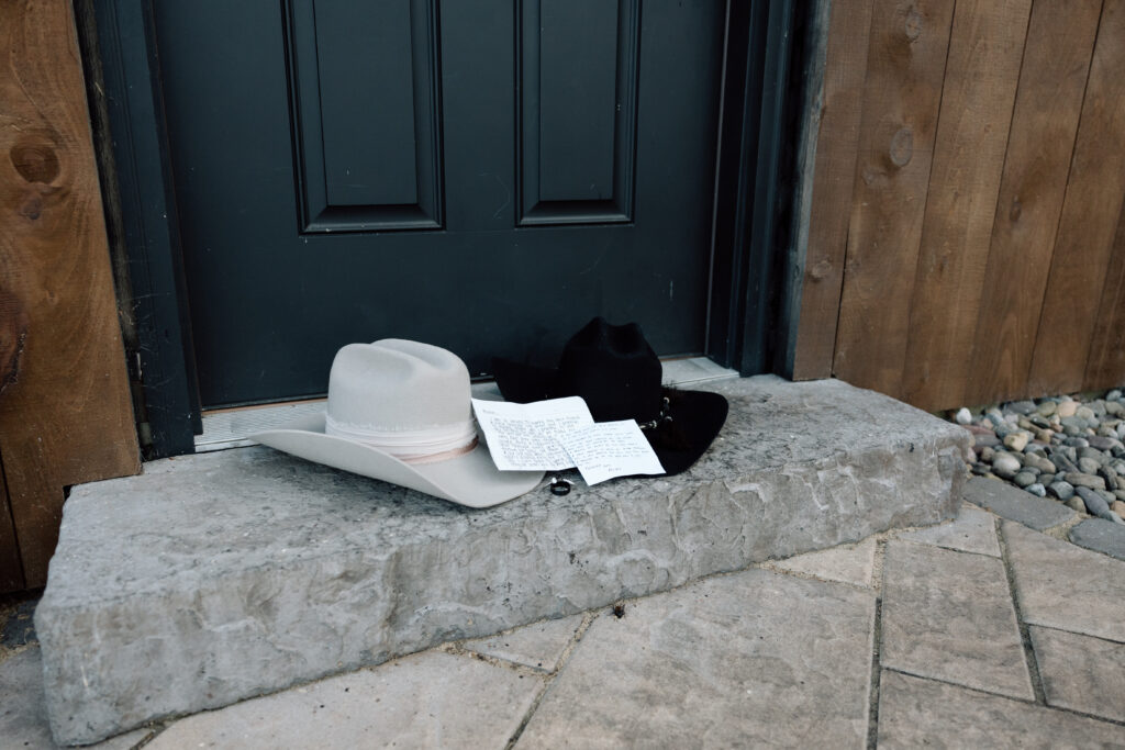 Cowboy hats and rings before wedding ceremony