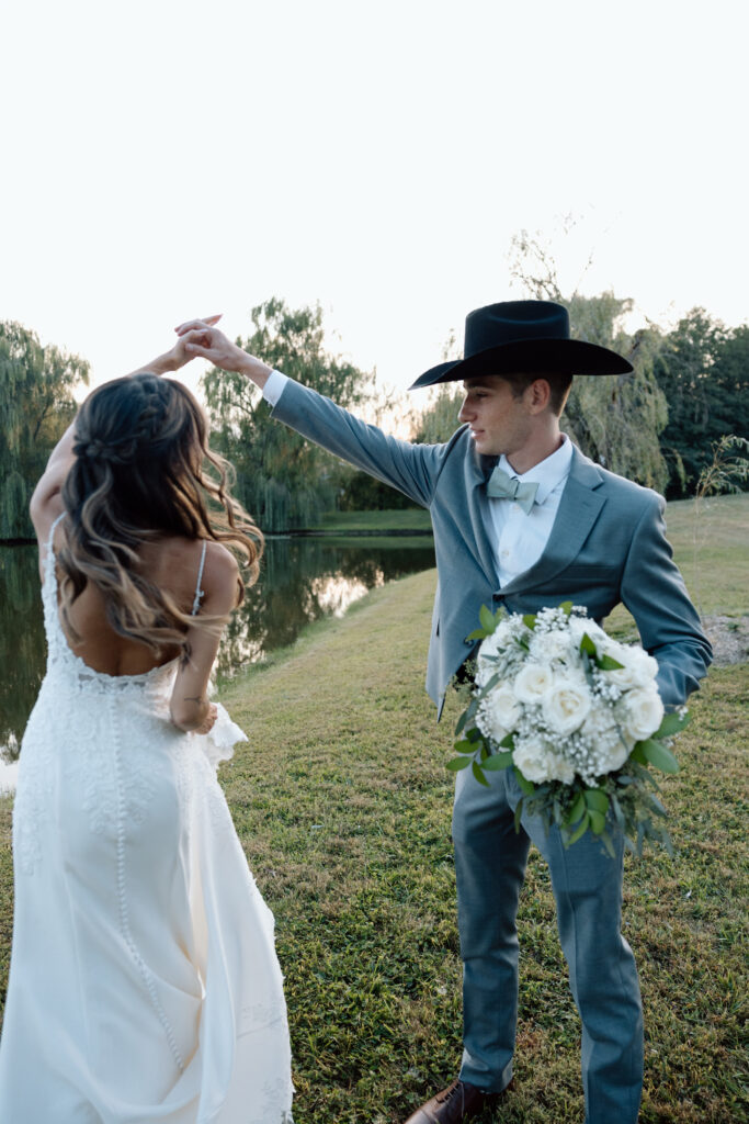 Bride and groom dance outside after wedding