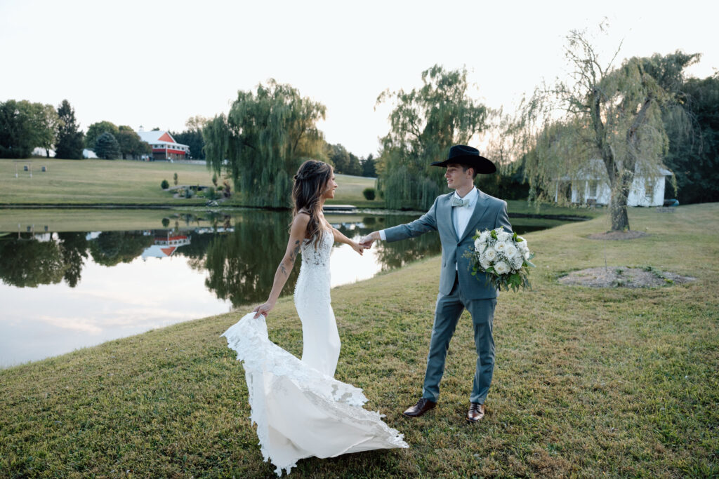 Couple dance in front of lake at Pennsylvania wedding venue