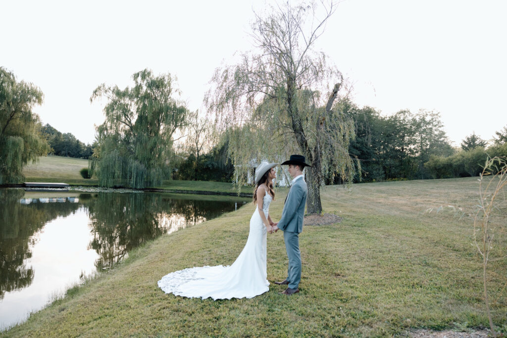 Couple hold hands in luxurious intimate wedding venue