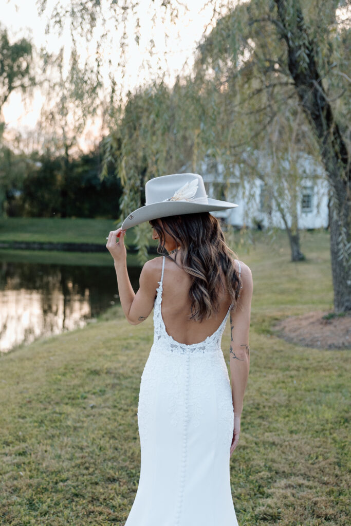 Bride looks down wearing beautiful wedding gown