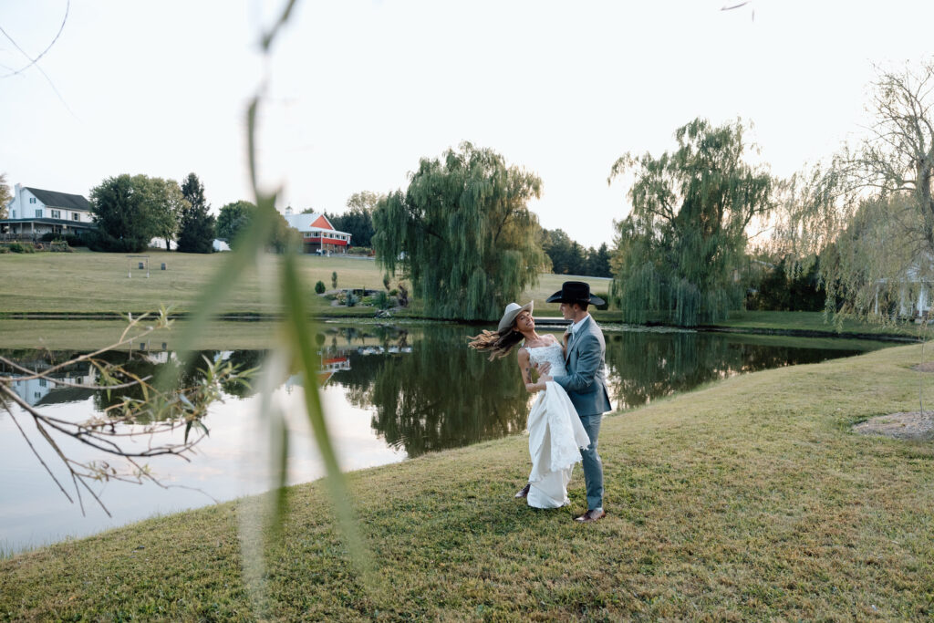 Bride and groom spin and dance overlooking rustic elegant Pennsylvania wedding venue