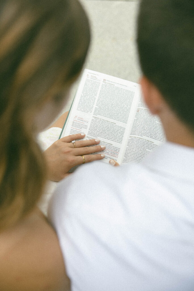 Engaged couple read the bible