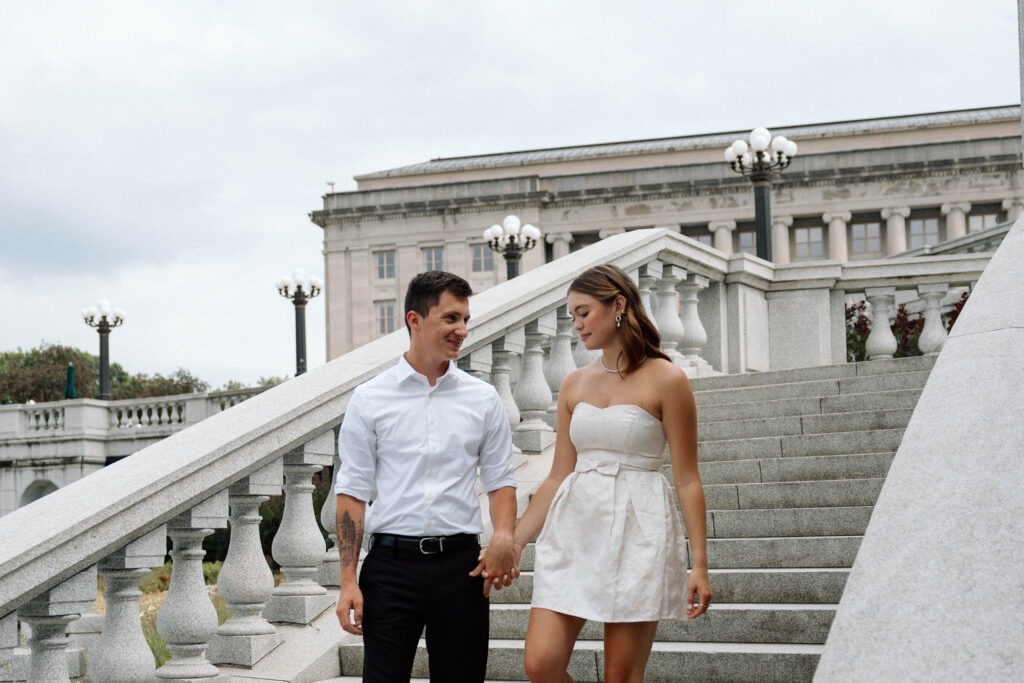 Couple descend the stairs of the capitol building