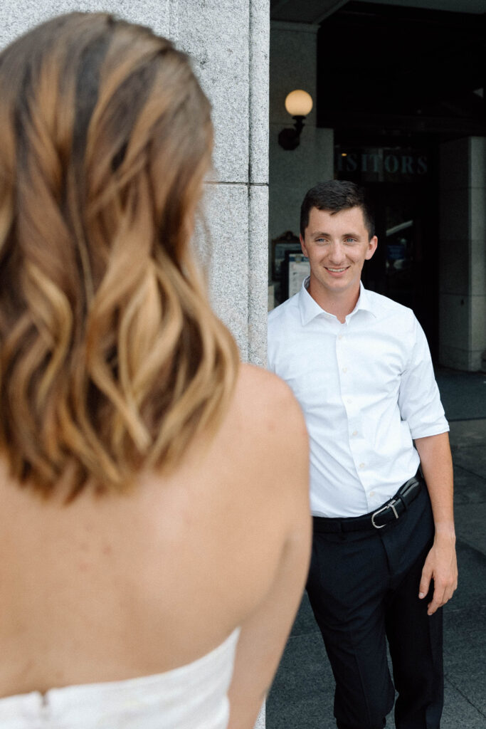 Couple view each other before engagement photos