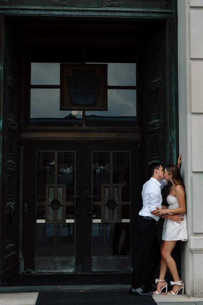 Engaged couple kiss at the Pennsylvania state Capitol