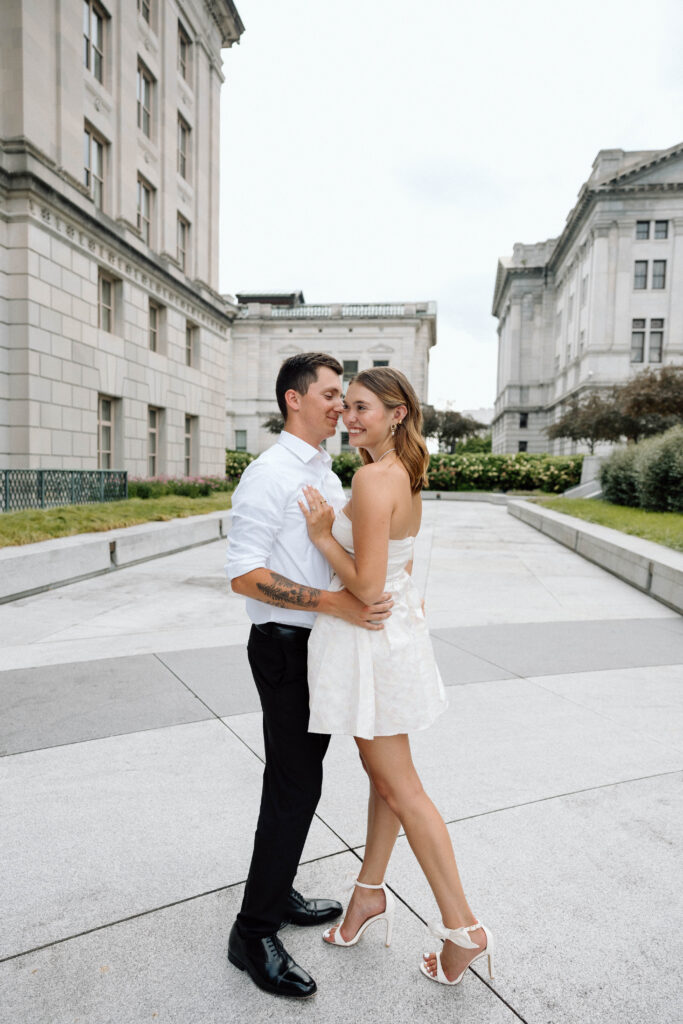 Pennsylvania couple smile outside capitol complex luxury engagement photos