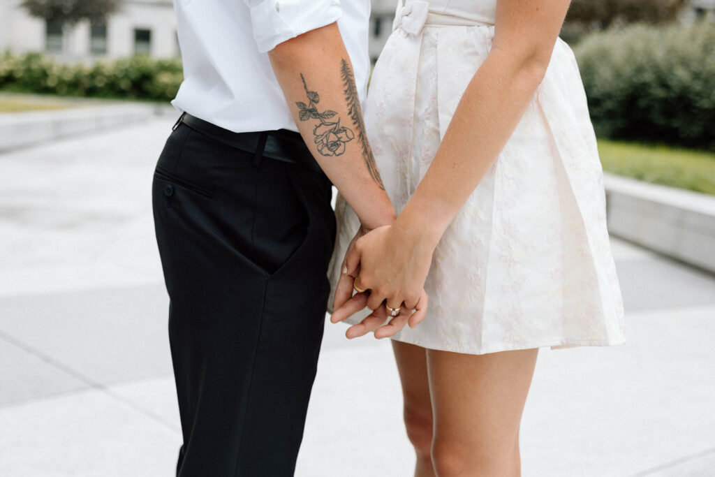 Engaged couple hold hands at the Pennsylvania State Capitol luxury engagement photos