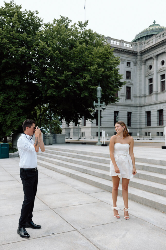 Man takes photo of woman outside capitol complex