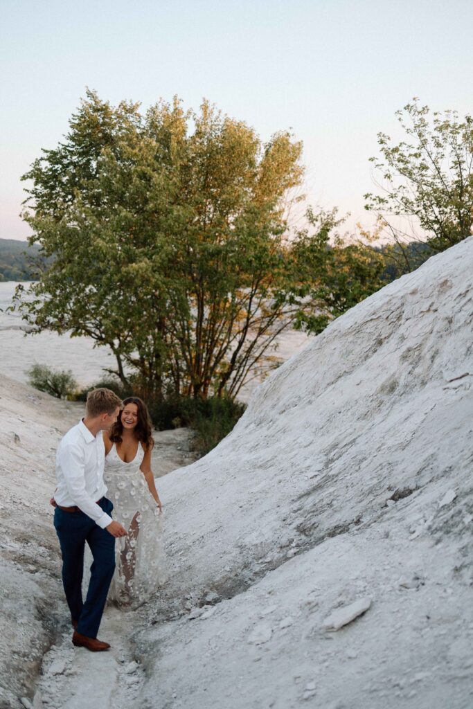 A couple walking at the White Cliffs of Conoy during their romantic engagement session.