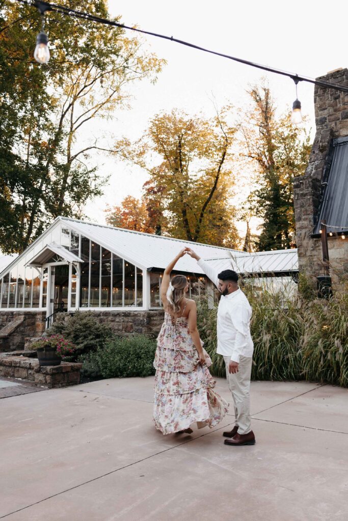 A couple dancing at Historic Shady Lane during their engagement session.