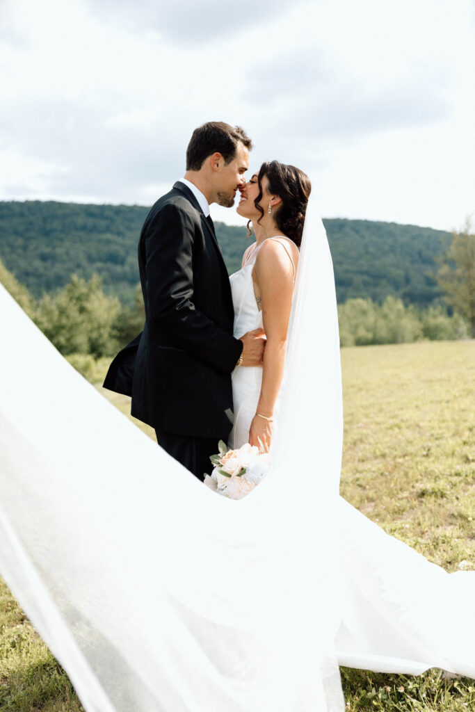 Bride and groom posing and looking into each others eyes during their wedding portraits.