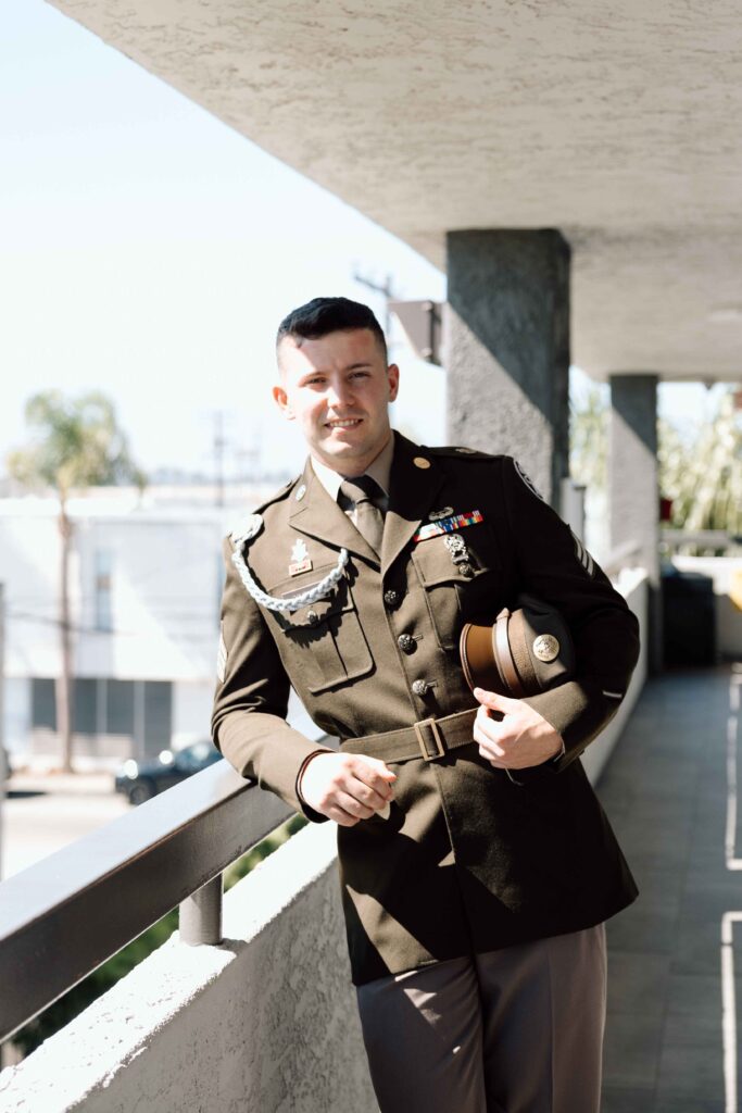 Close up shot of the groom in his military uniform. 