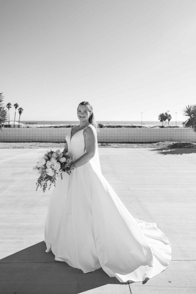 Bridal portraits with the ocean and palm trees in the background.