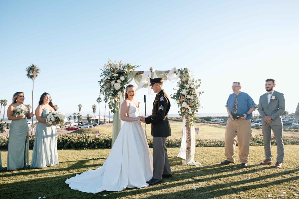 Destination wedding photographer captures bride and groom laughing during their wedding in San Diego.