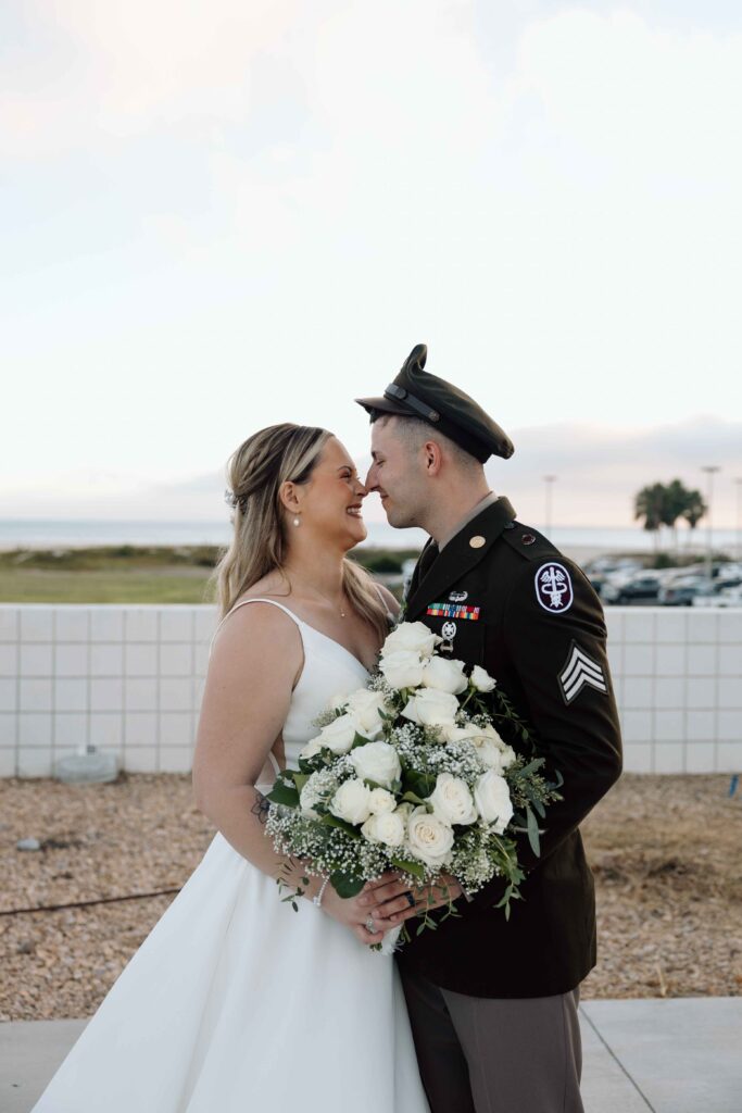 Bride and groom looking at one another in love during their wedding portraits.