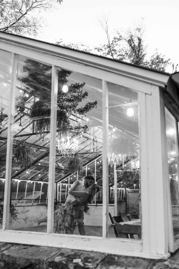 Man dipping his fiancee as they dance at Historic Shady Lane.