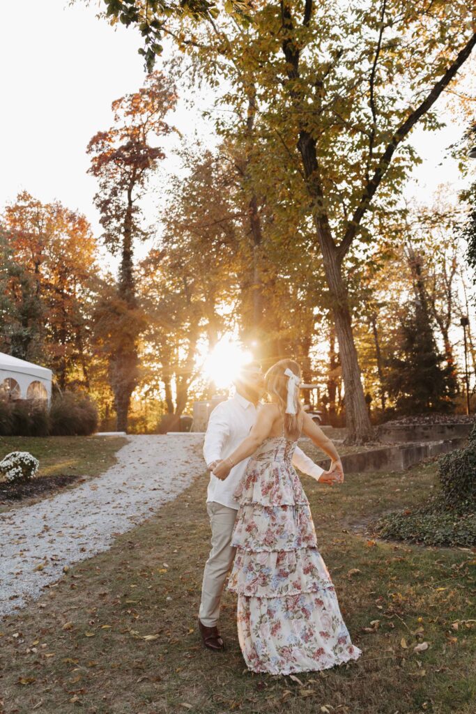 Couple dancing outside as the sun goes down.