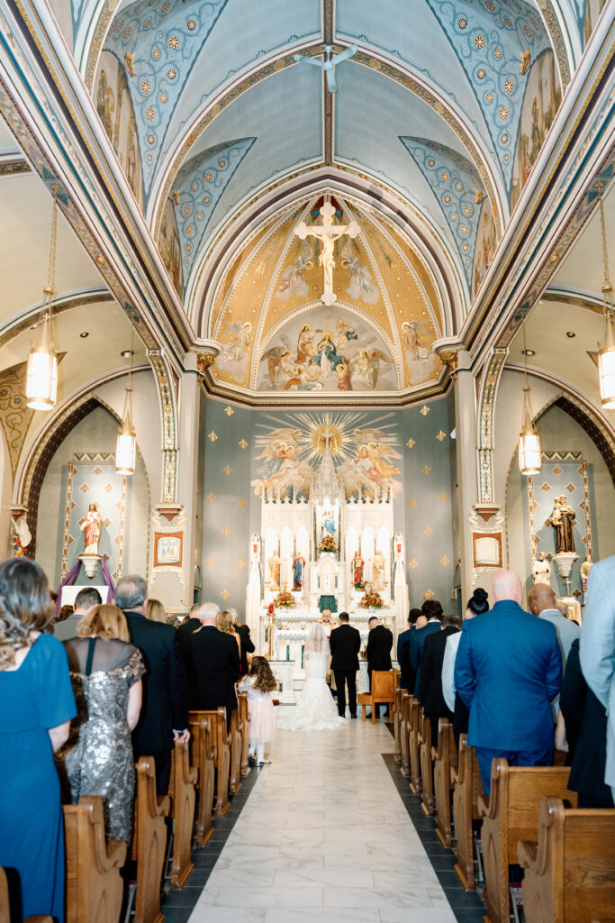 Elegant wedding photos of a wedding ceremony in a church.