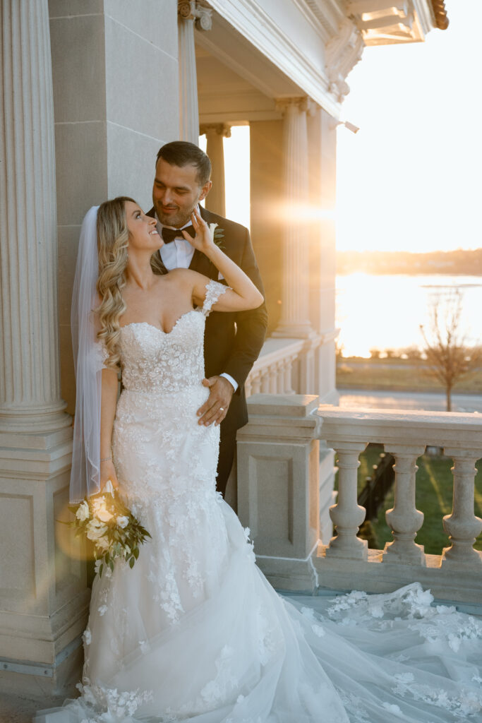 Bride and groom looking into each others eyes at sunset at King Mansion.