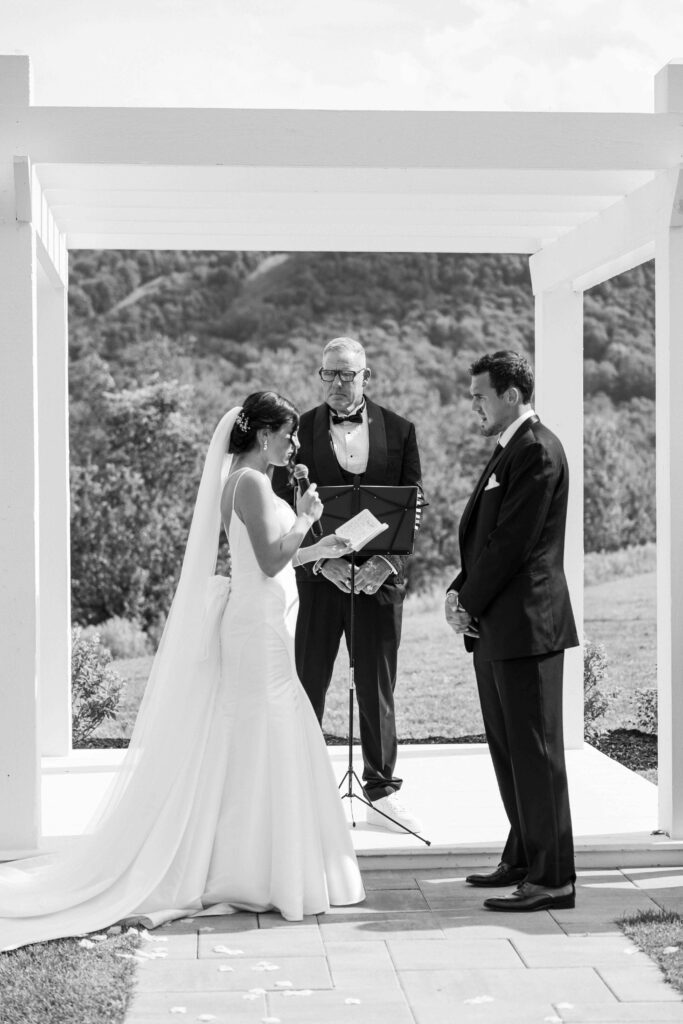 Bride telling the groom her vows at The Lookout at Hope Lake.