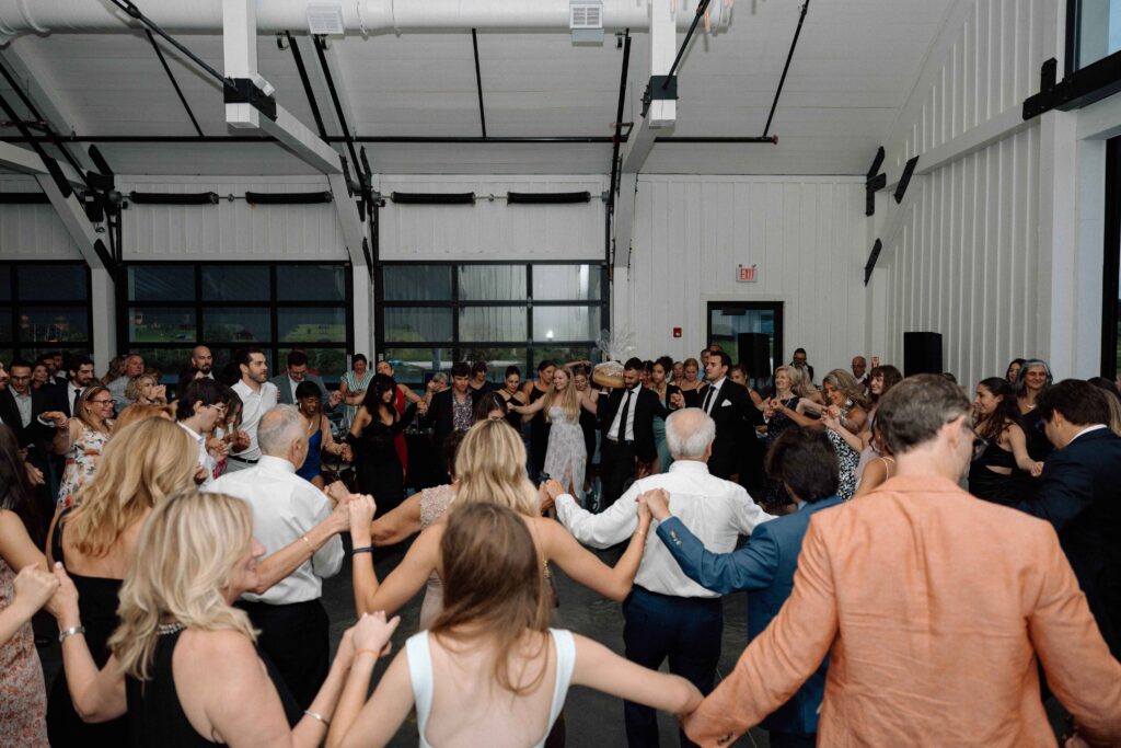 Guests on the dance floor with the newlyweds at The Lookout at Hope Lake.