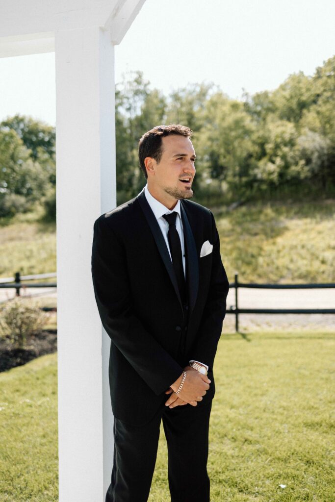 Groom seeing his bride walk down the aisle. 