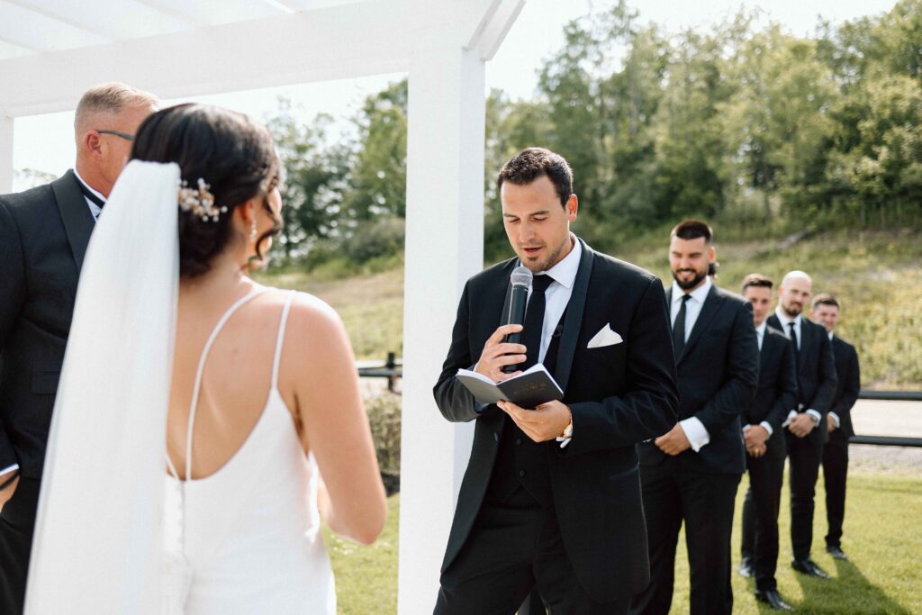 Groom saying his vows at the wedding ceremony. 