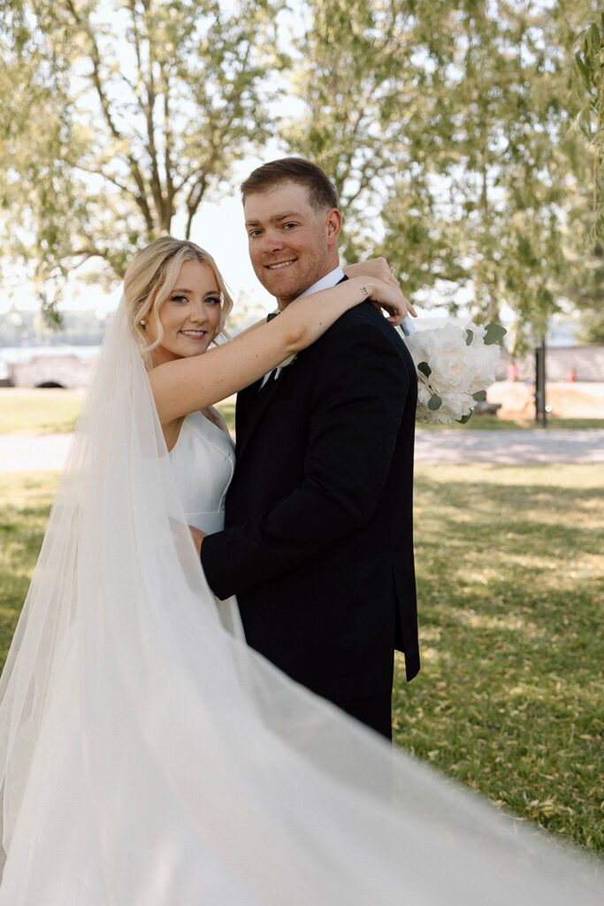 Bride and groom holding one another during their bridal portraits.