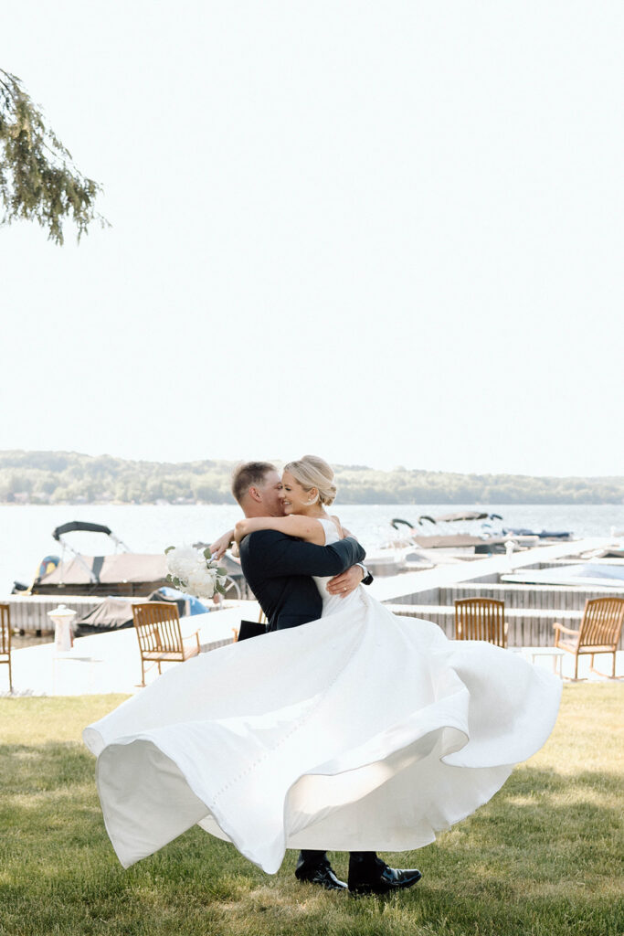 Groom swinging his bride after they got married. 