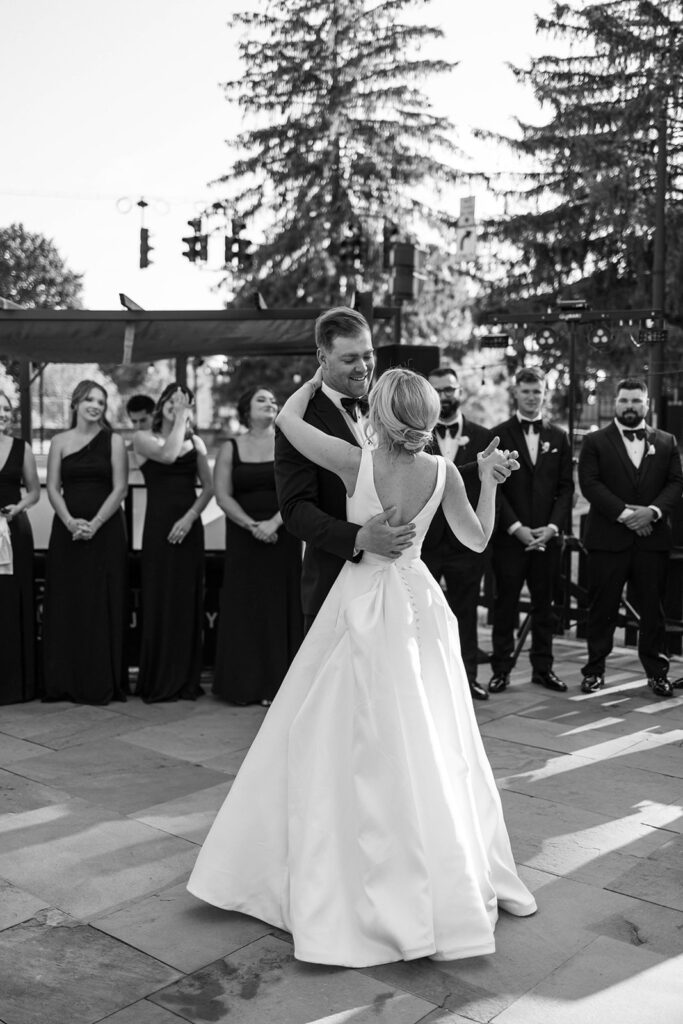 Bride and groom sharing their first dance as part of their wedding photography timeline.