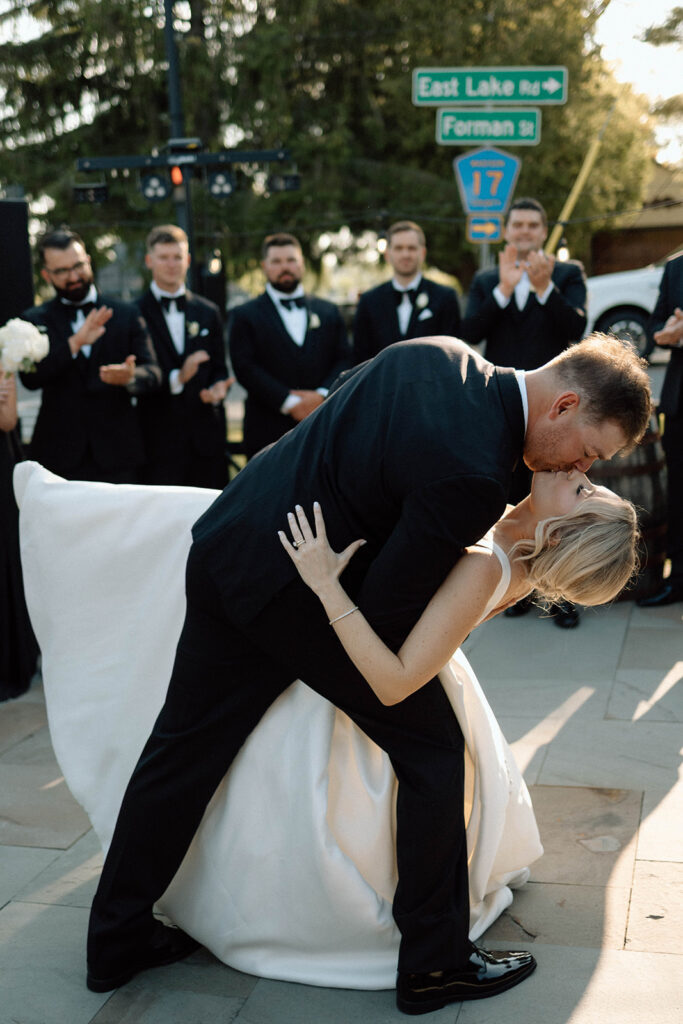 Groom dipping his bride during their first dance.