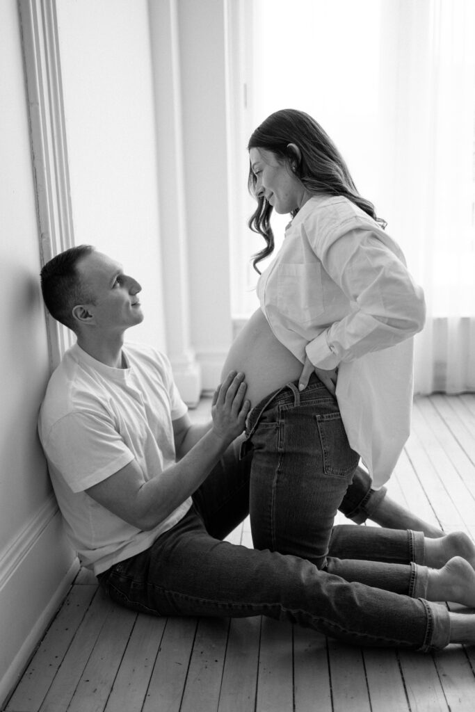 Intimate maternity photos of a couple happy and pregnant. 