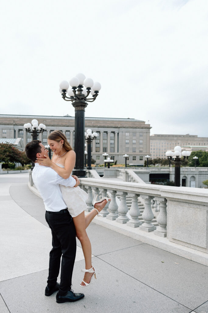 Couple look at one another in love during their luxury engagement photoshoot.