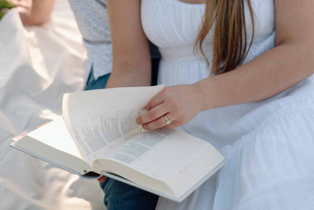 Bride to be turning a page of the Bible.