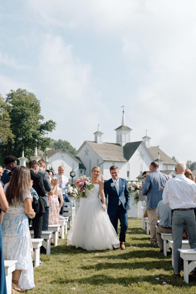 Bride and groom walking down the aisle. 