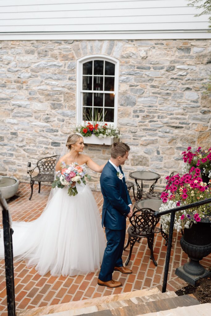 Wedding photography tips for photographers while bride taps the groom on his shoulder for their first look.