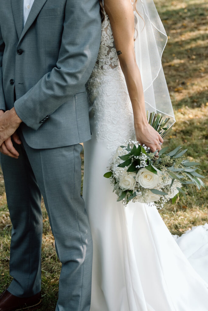 Close up of bride and grooms wedding outfits to give an idea of how to pick a wedding photographer.