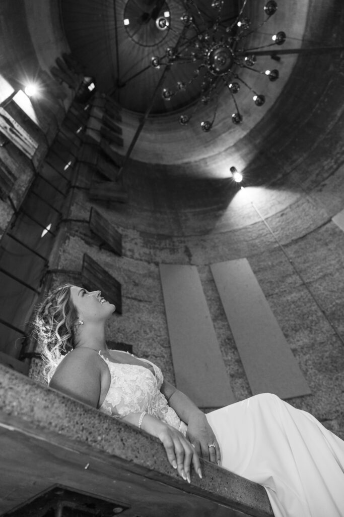 Bride looking up at the cool architecture at the Goldfish Barn Event Center in PA.