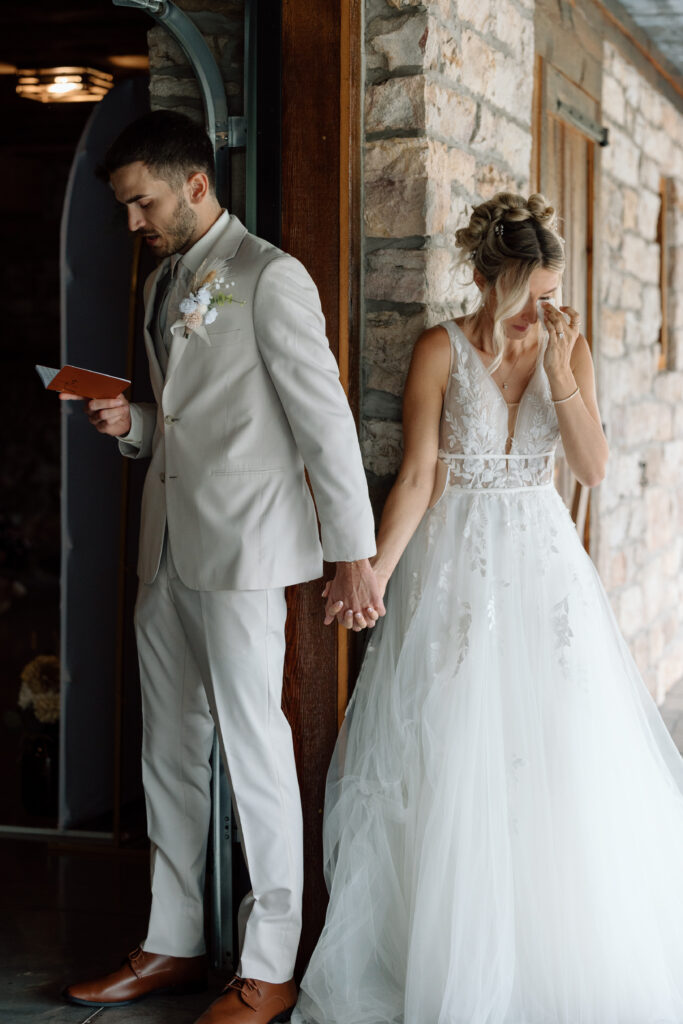 Bride and groom reading vows during their first touch.