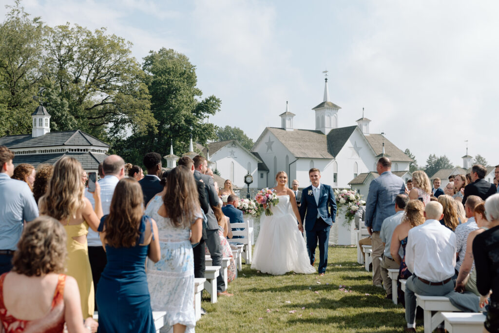 Bride and groom walking down the aisle at the Star Barn, one of the best Pennsylvania wedding venues.