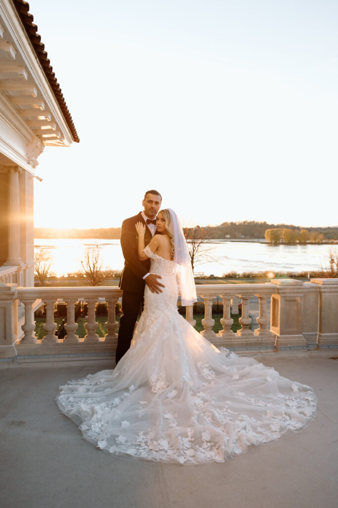 Bride and groom at King Mansion, one of the best Pennsylvania wedding venues, at golden hour on the balcony.