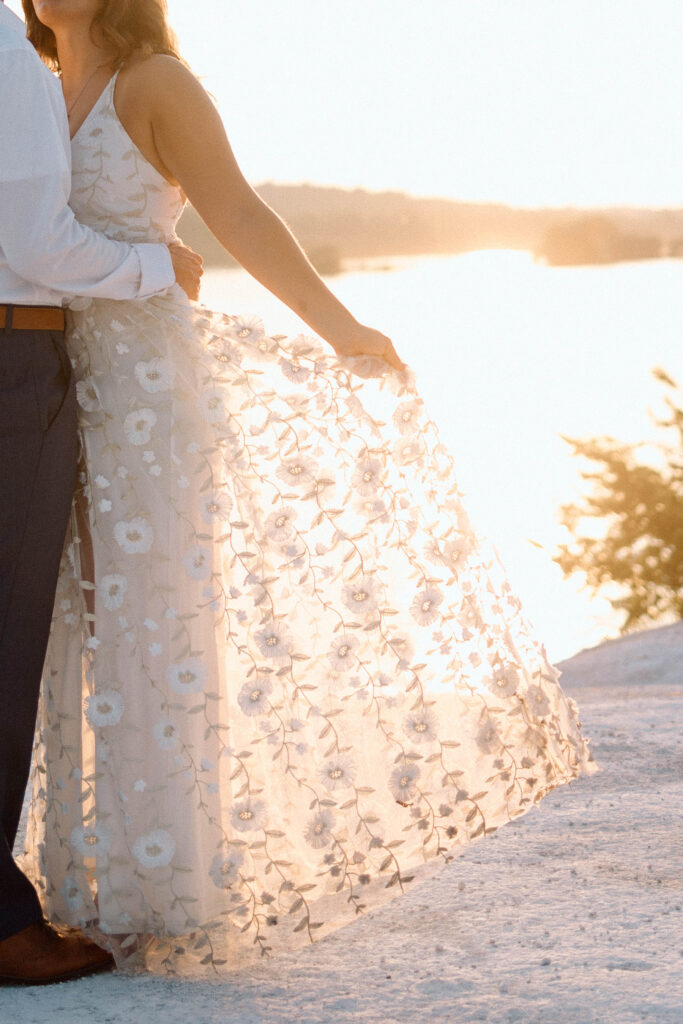 Engaged soon to be bride with her flowy dress sharing what to wear for engagement pictures. 