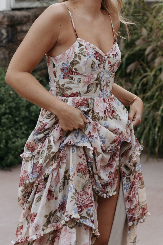 Close up of a bride's engagement session outfit, a floral dress. 