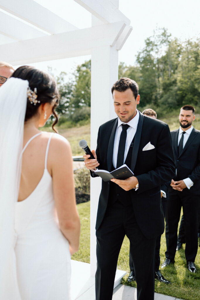 Groom giving his vows during their luxury wedding ceremony.
