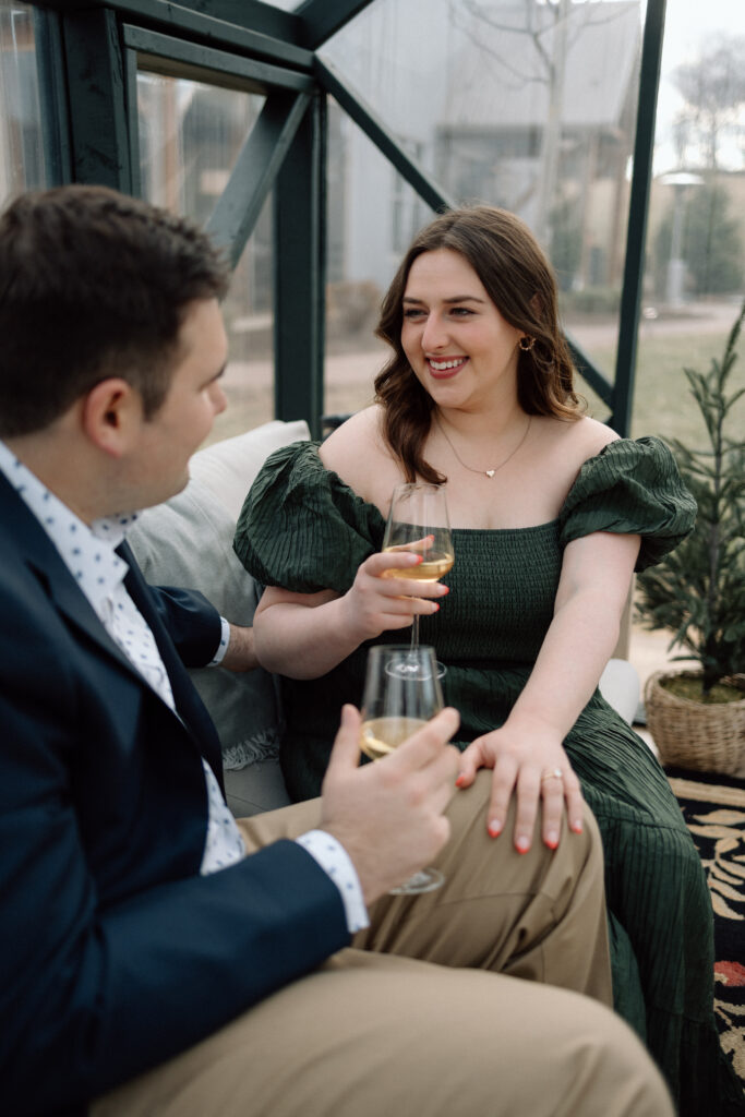 Girl smiling at her finace as they take engagement photos.